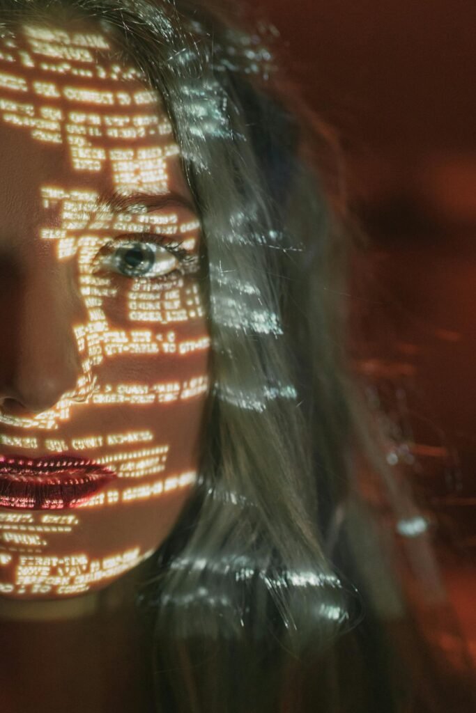 pexels-photo-5473957-5473957 Abstract cyberpunk portrait with code projected on a woman's half face, symbolizing technology integration.