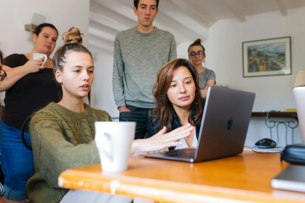 pexels-photo-1595392-1595392 A diverse group of adults collaborating in a cozy indoor office space.