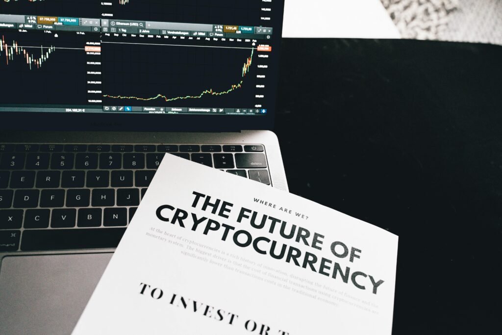 pexels-photo-6771244-6771244 A detailed look at cryptocurrency market trends using a laptop and analytical document.